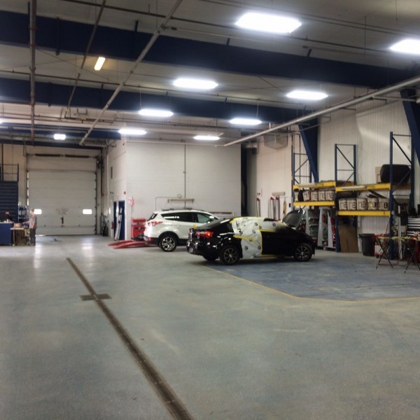 Body repair and panel replacement department with in floor pulling station