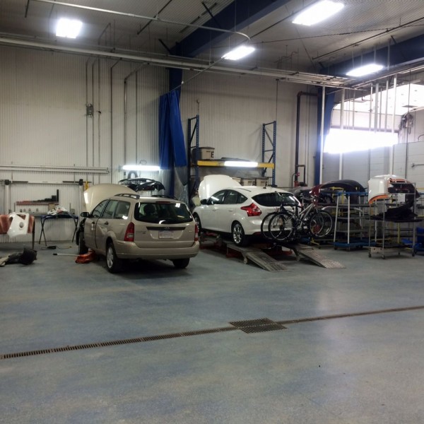 Body repair and panel replacement department with smaller mounting and pulling station for Uni-body pulling on smaller cars