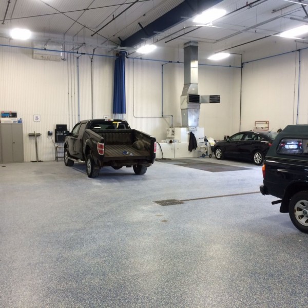 Refinish department with dual curtained down draft priming stations